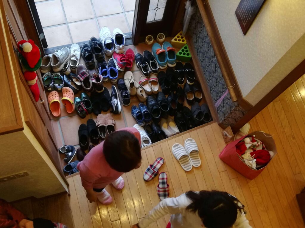 Japanese genkan with many shoes