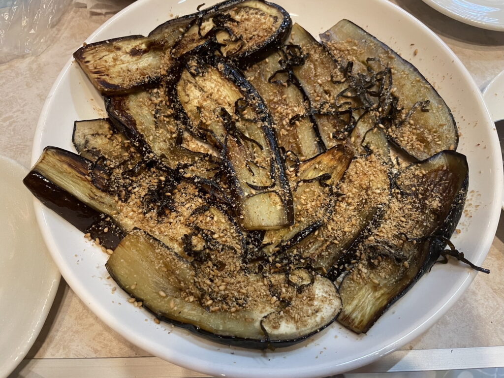 Grilled eggplant topped with sesame
