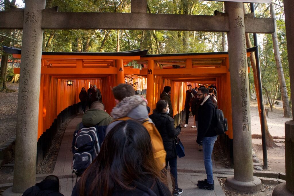 Fushimi Inari Shrine grounds with red torii gates in Kyoto Japan