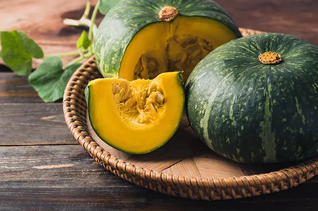 Japanese pumpkin sliced on tray